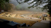 A misty, foggy view of Amphitheater near completion.