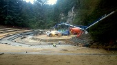 Panorama of large concrete pouring machine, pouring landing on east side of bowl.